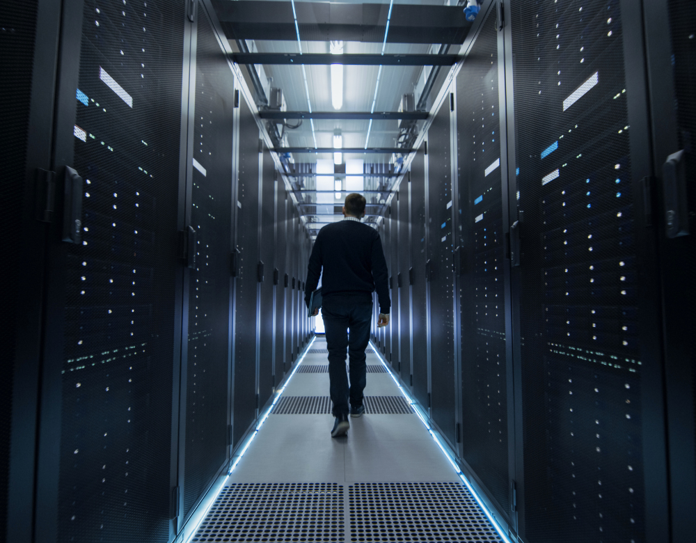 A man walks in data center generator